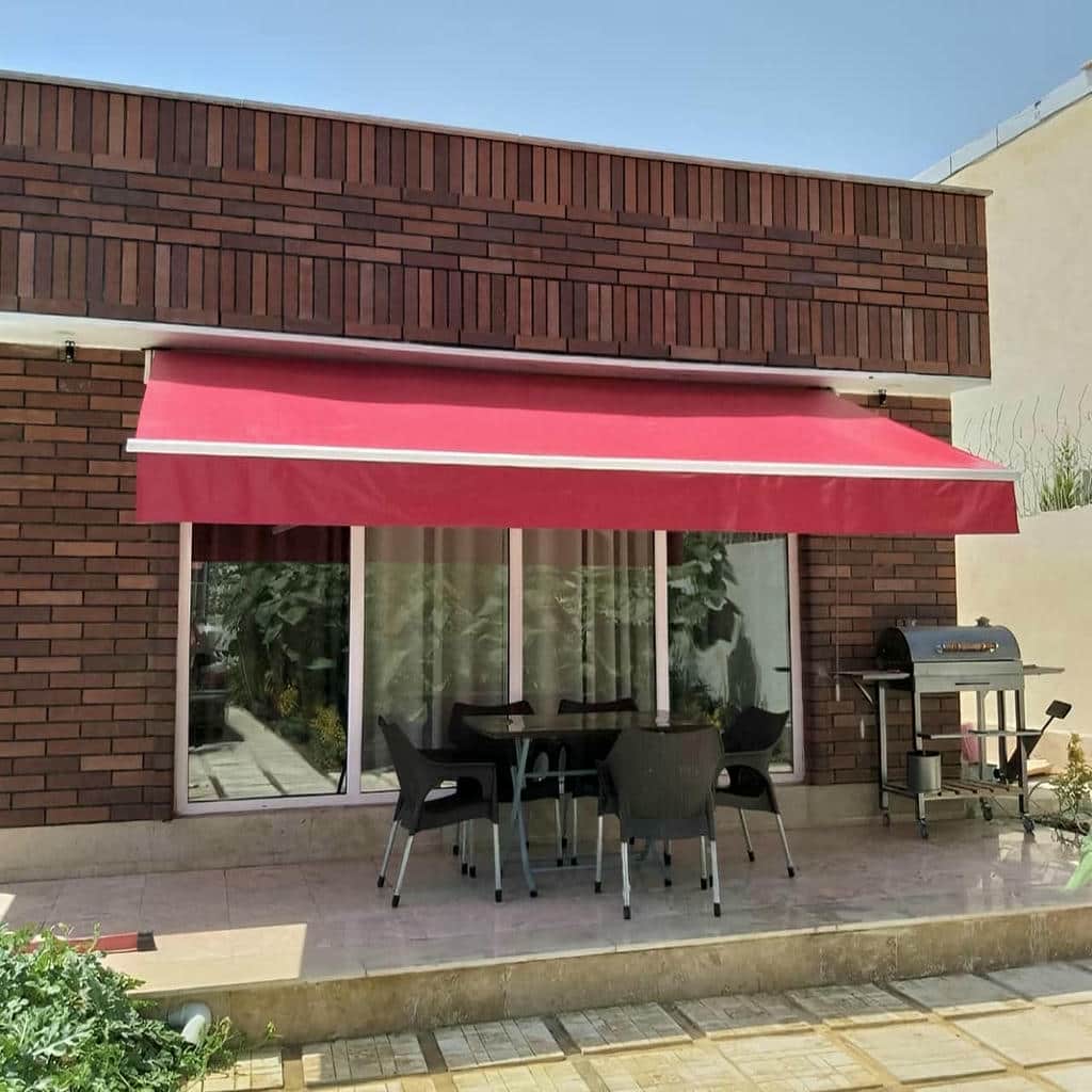 سایبان برقی بازویی نمای ساختمان